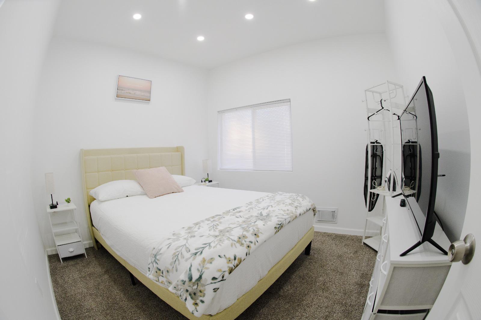 Bedroom with king bed and floral bedding