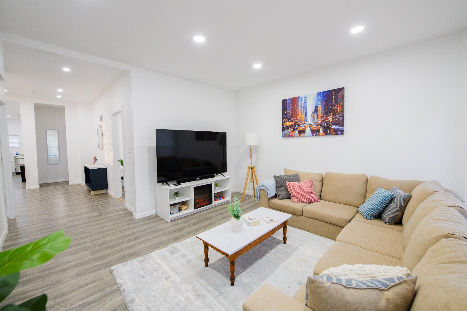 Modern living room with sectional and fireplace