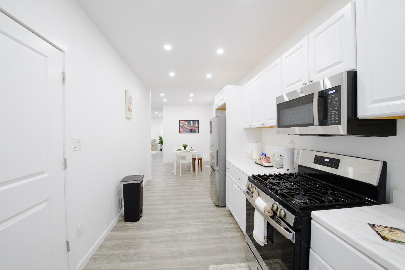 Galley kitchen with stainless appliances